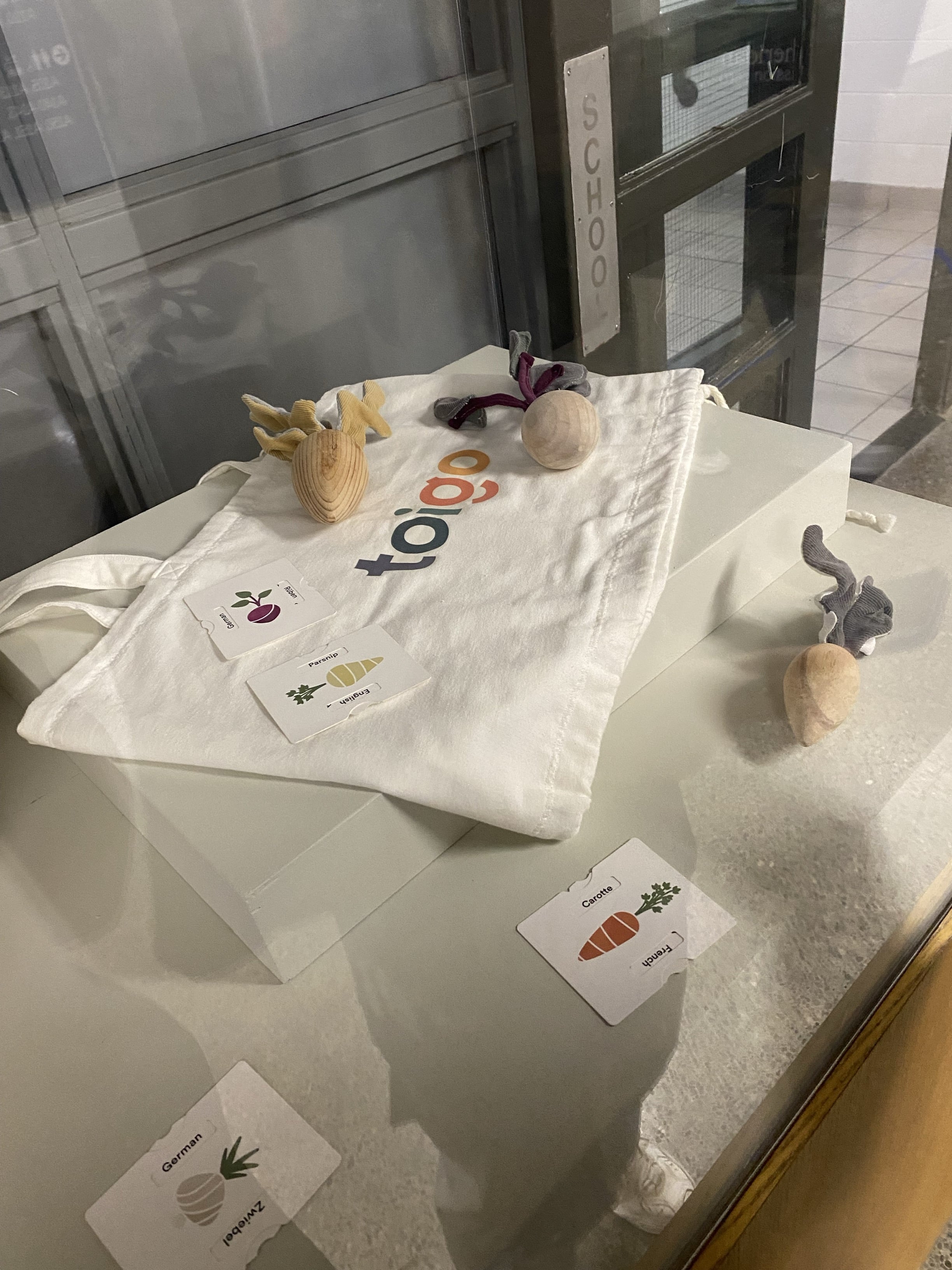 This one has some carrots made of wood. The leaves of the carrot are made of fabric. Here is another canvas bag with the iconic logo printed on it.